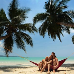 paradise family relax on the beach on havelock island in andaman in india